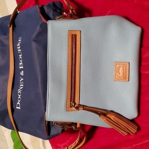 Dooney and Bourke pebble grain crossbody with tassel, dust cover.